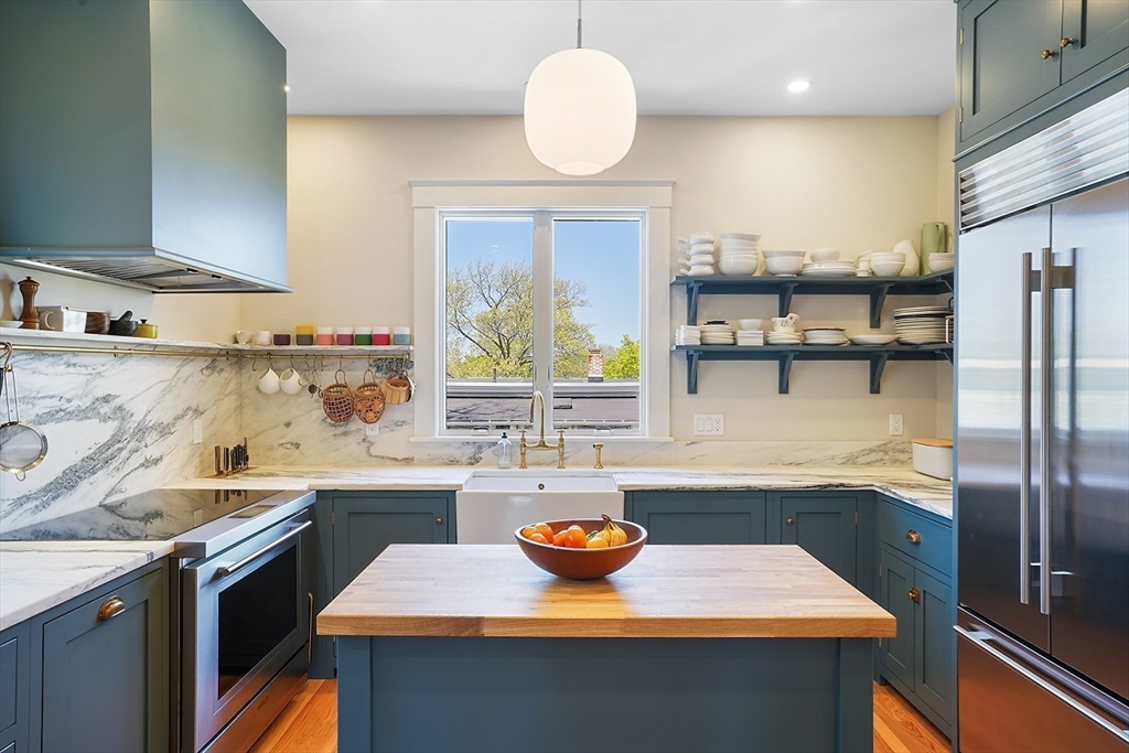 89 Upland Road, Unit 2 Cambridge, MA 02140 - Photo 4 of 17 a kitchen with a sink appliances and cabinets
