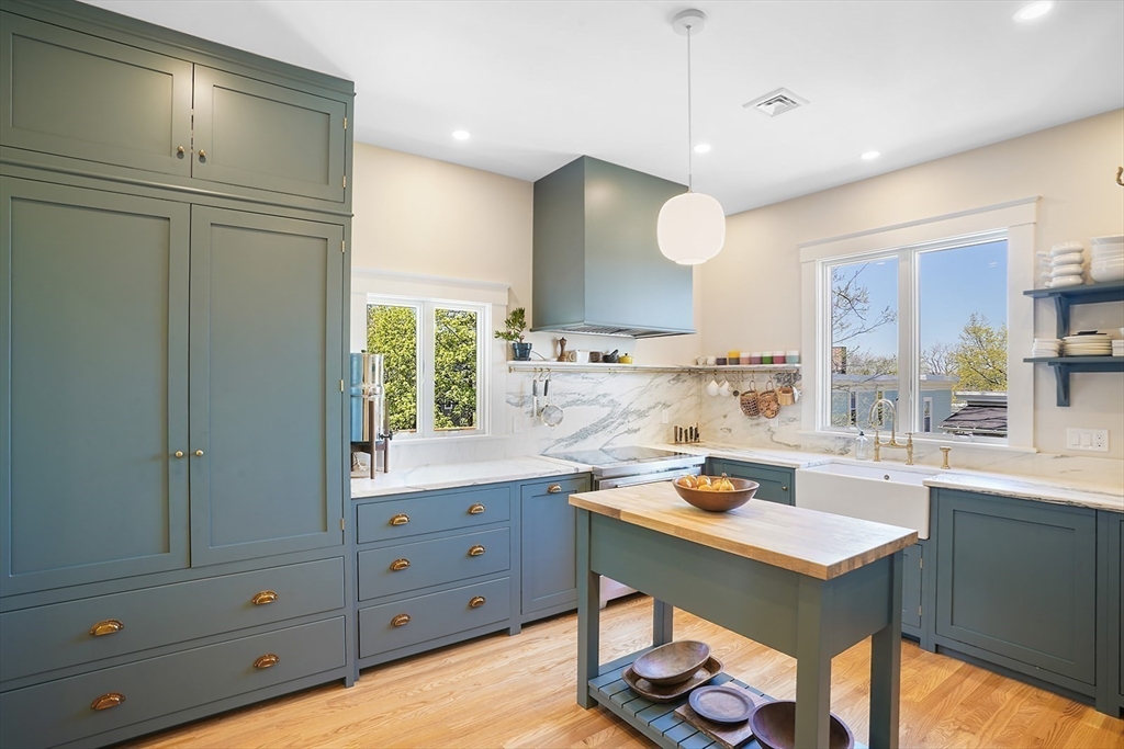 89 Upland Road, Unit 2 Cambridge, MA 02140 - Photo 5 of 17 a kitchen with a sink appliances and cabinets