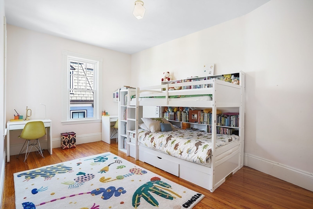 89 Upland Road, Unit 2 Cambridge, MA 02140 - Photo 10 of 17 a bed room with bed and window