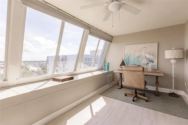 a workspace with furniture and a window