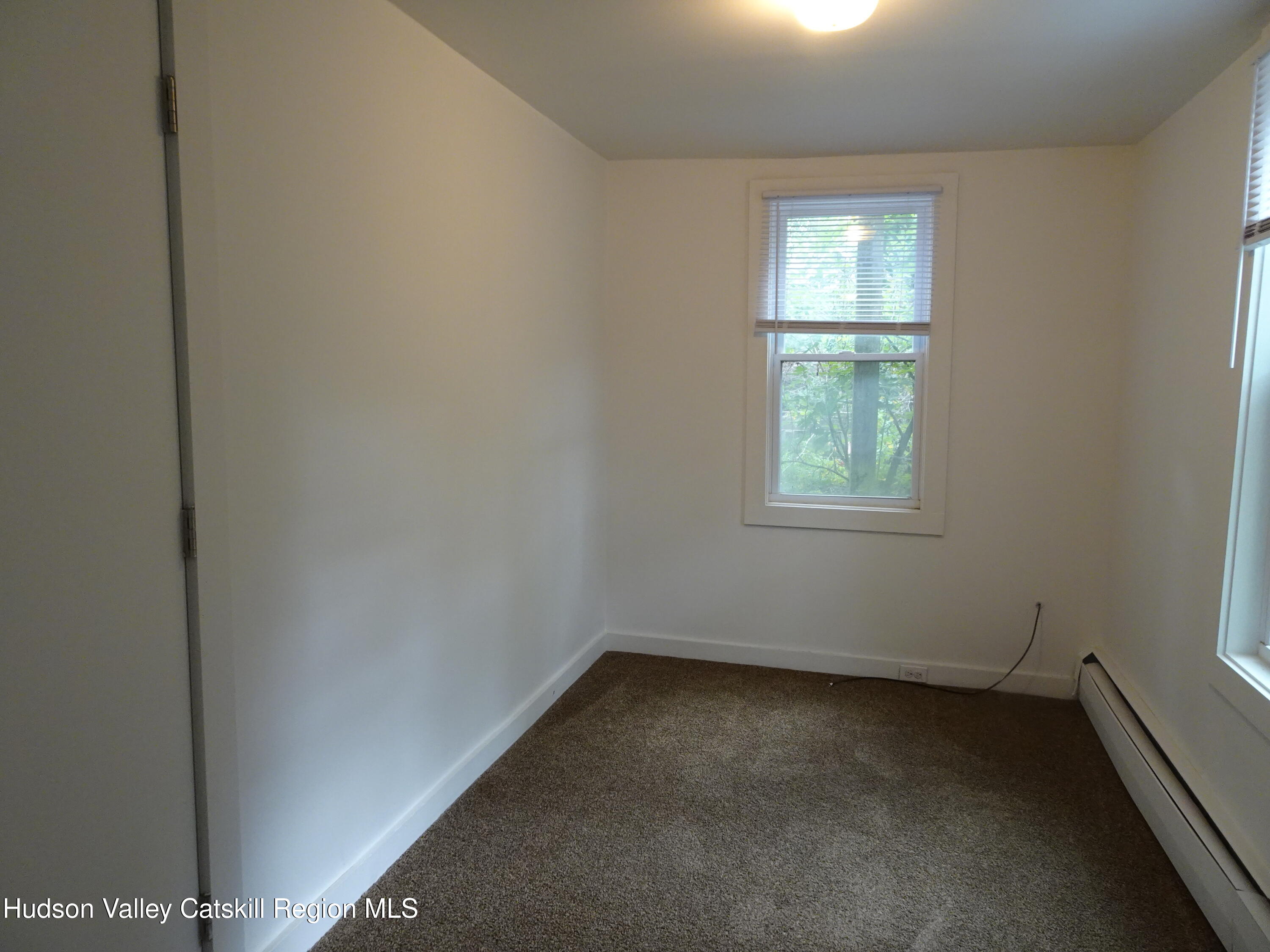 682 Highway 217 Hudson, NY 12534 - Photo 11 of 36 an empty room with a window