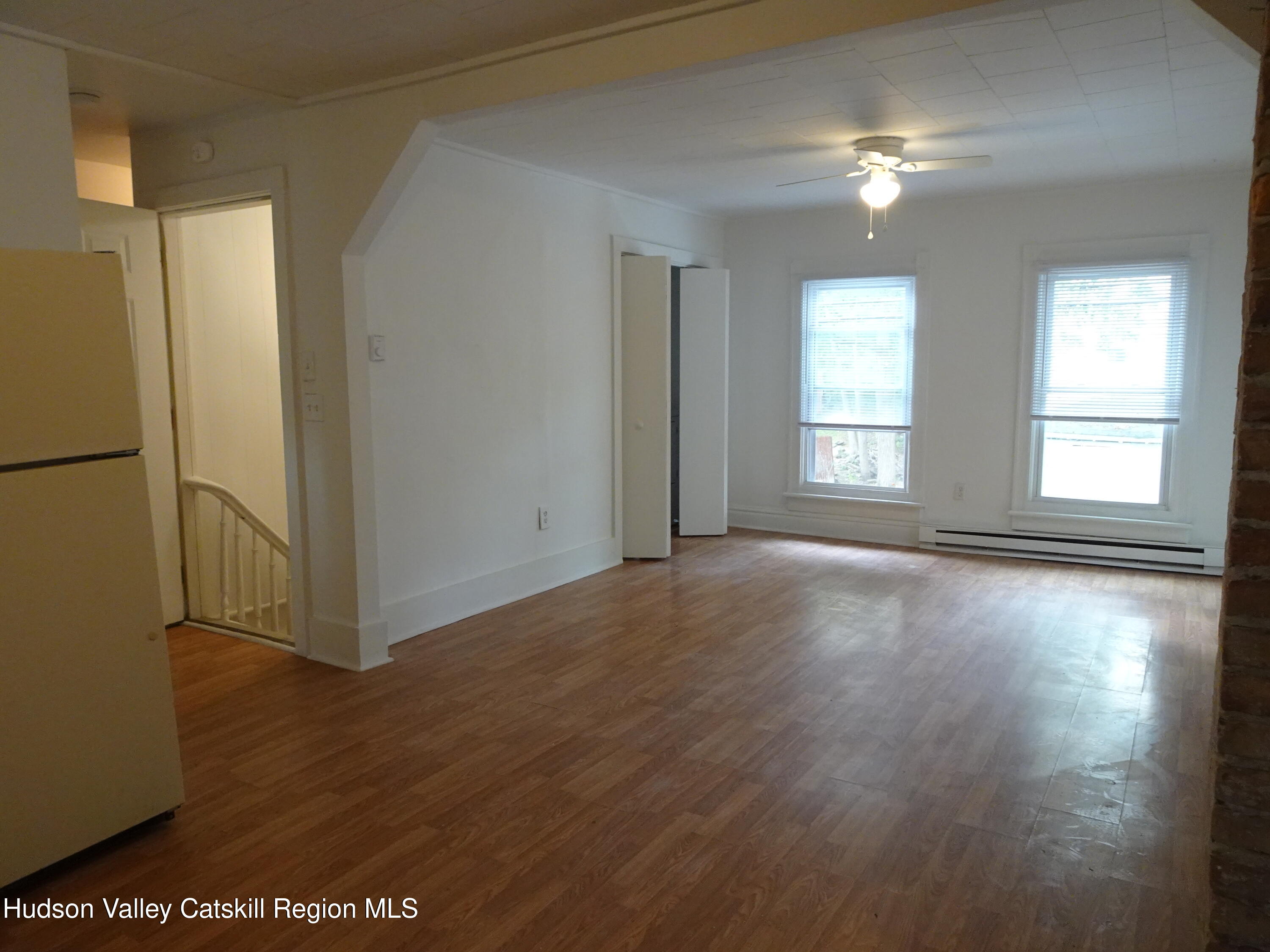 682 Highway 217 Hudson, NY 12534 - Photo 18 of 36 a view of livingroom with hardwood floor and window
