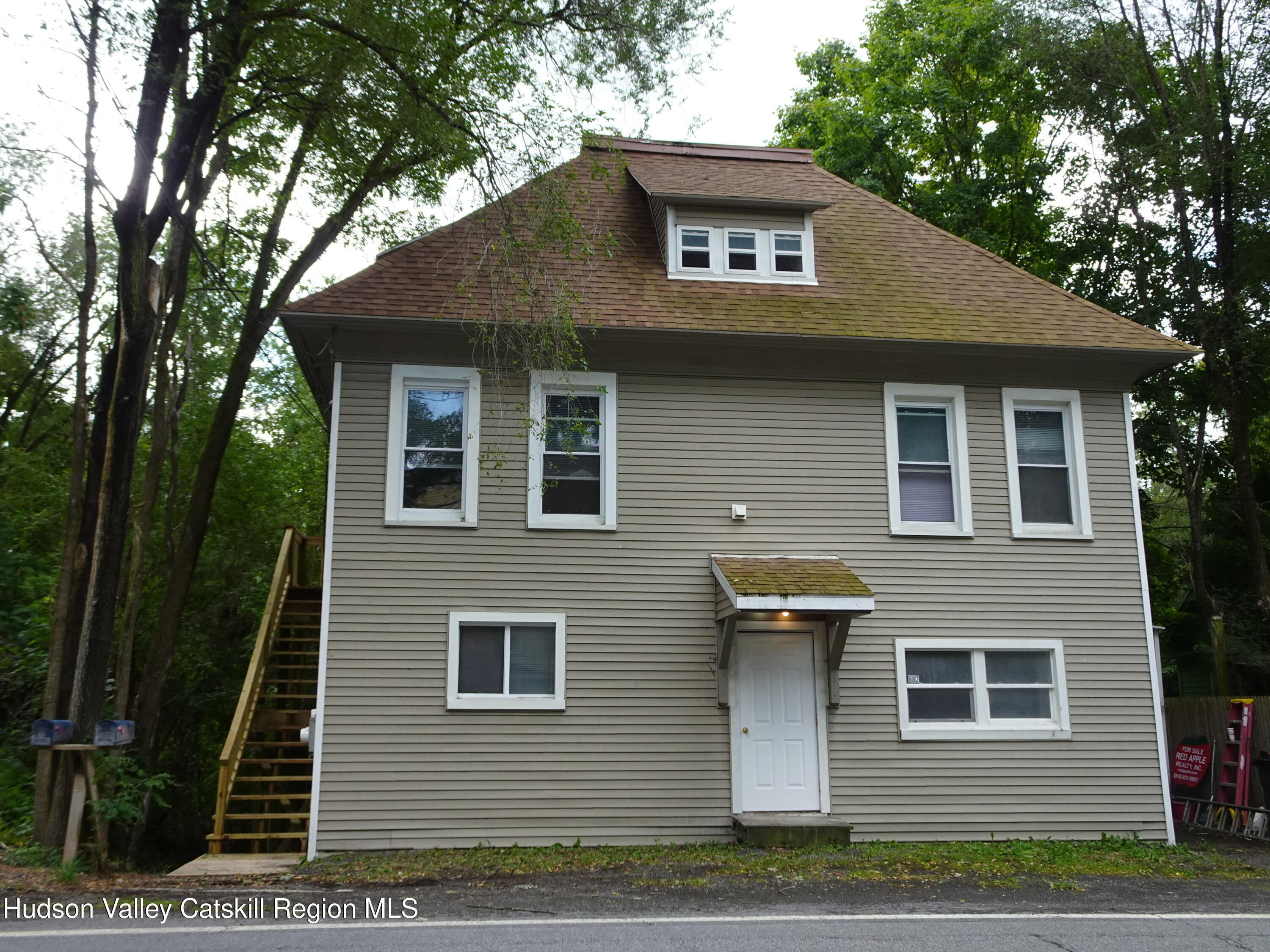 682 Highway 217 Hudson, NY 12534 - Photo 2 of 36 a front view of a house with garage