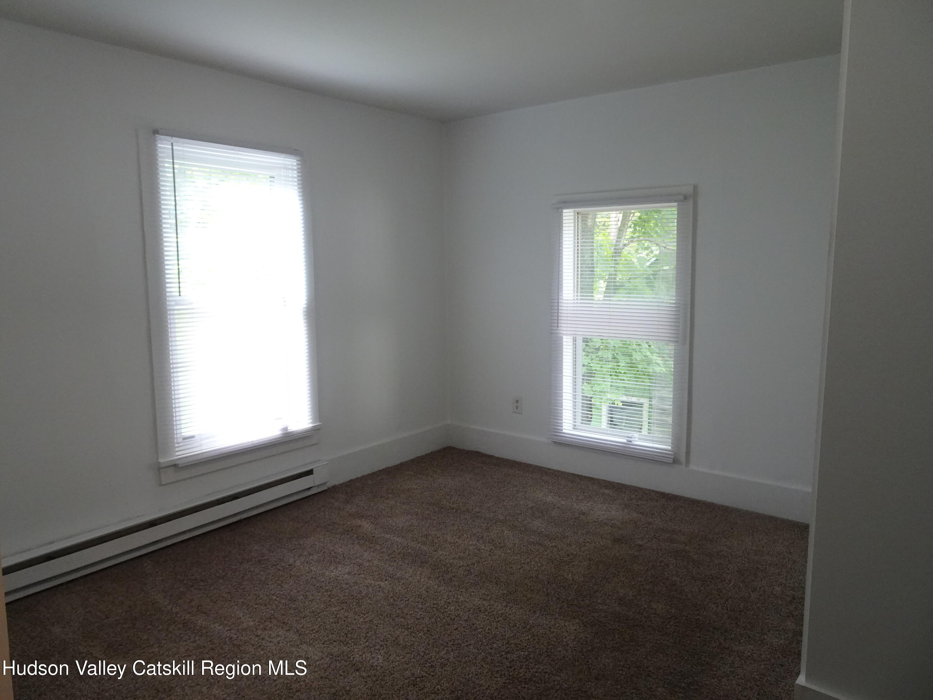 682 Highway 217 Hudson, NY 12534 - Photo 21 of 36 an empty room with a window