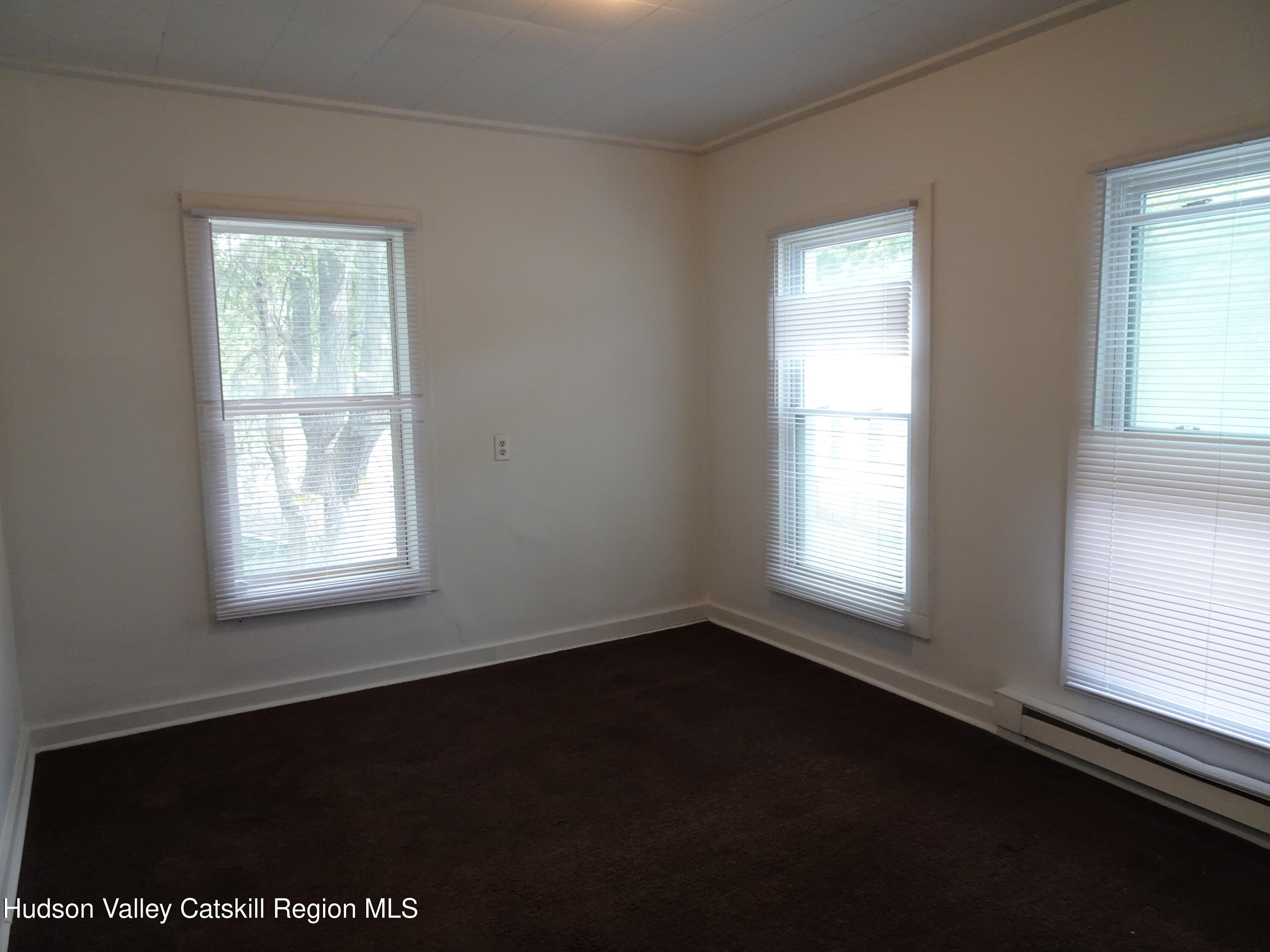 682 Highway 217 Hudson, NY 12534 - Photo 22 of 36 a view of an empty room with a window