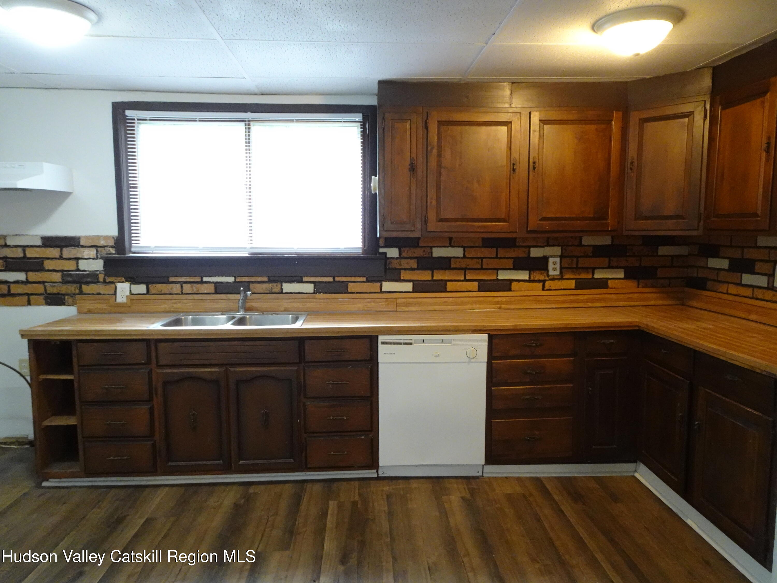 682 Highway 217 Hudson, NY 12534 - Photo 3 of 36 a kitchen with a sink and cabinets