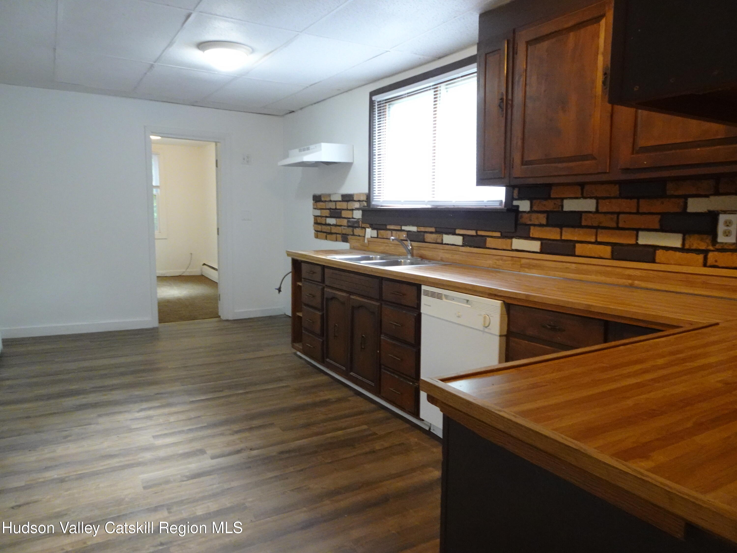 682 Highway 217 Hudson, NY 12534 - Photo 4 of 36 a kitchen with stainless steel appliances granite countertop a sink and wooden cabinets
