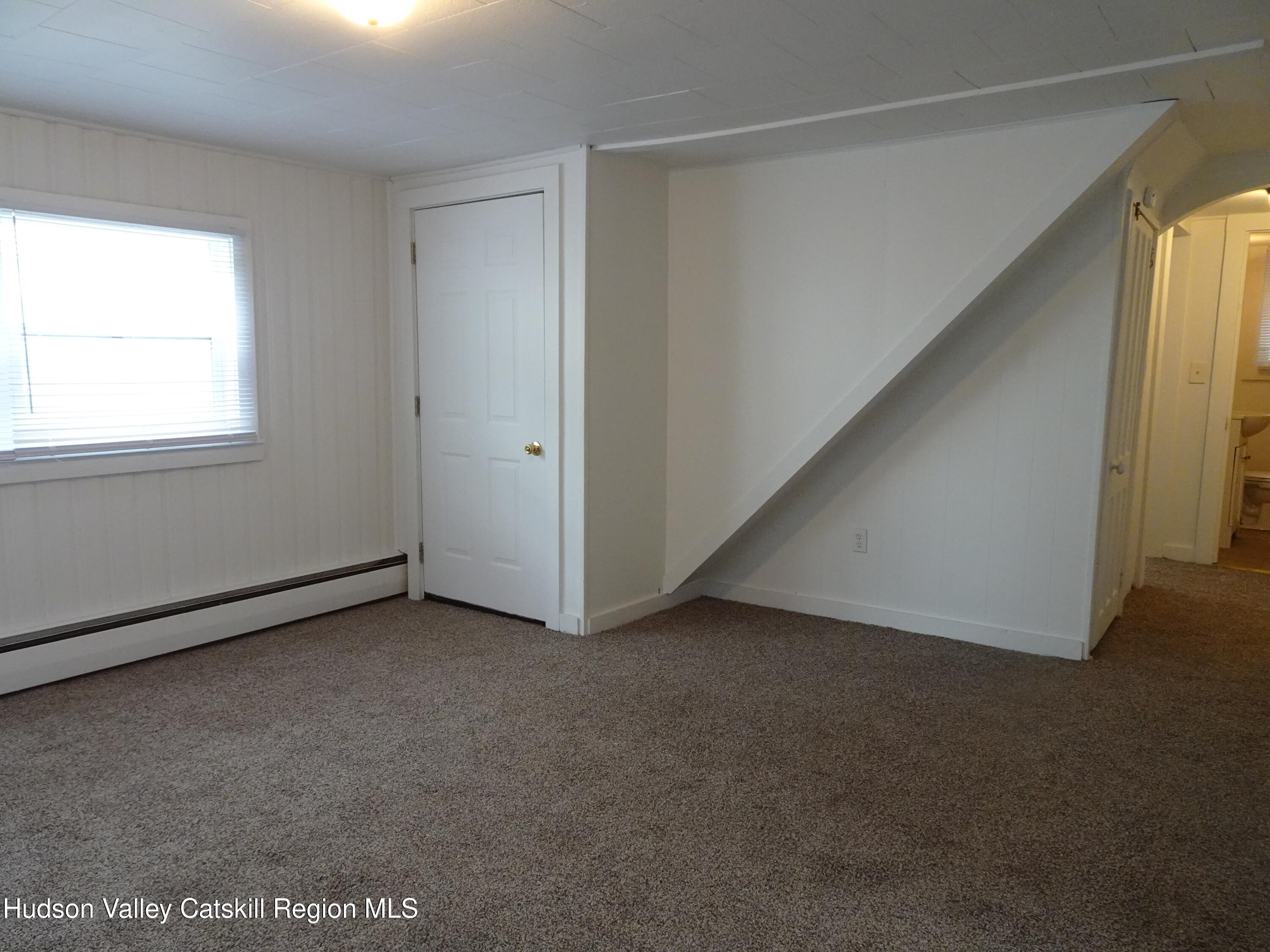 682 Highway 217 Hudson, NY 12534 - Photo 7 of 36 a view of an empty room with a window