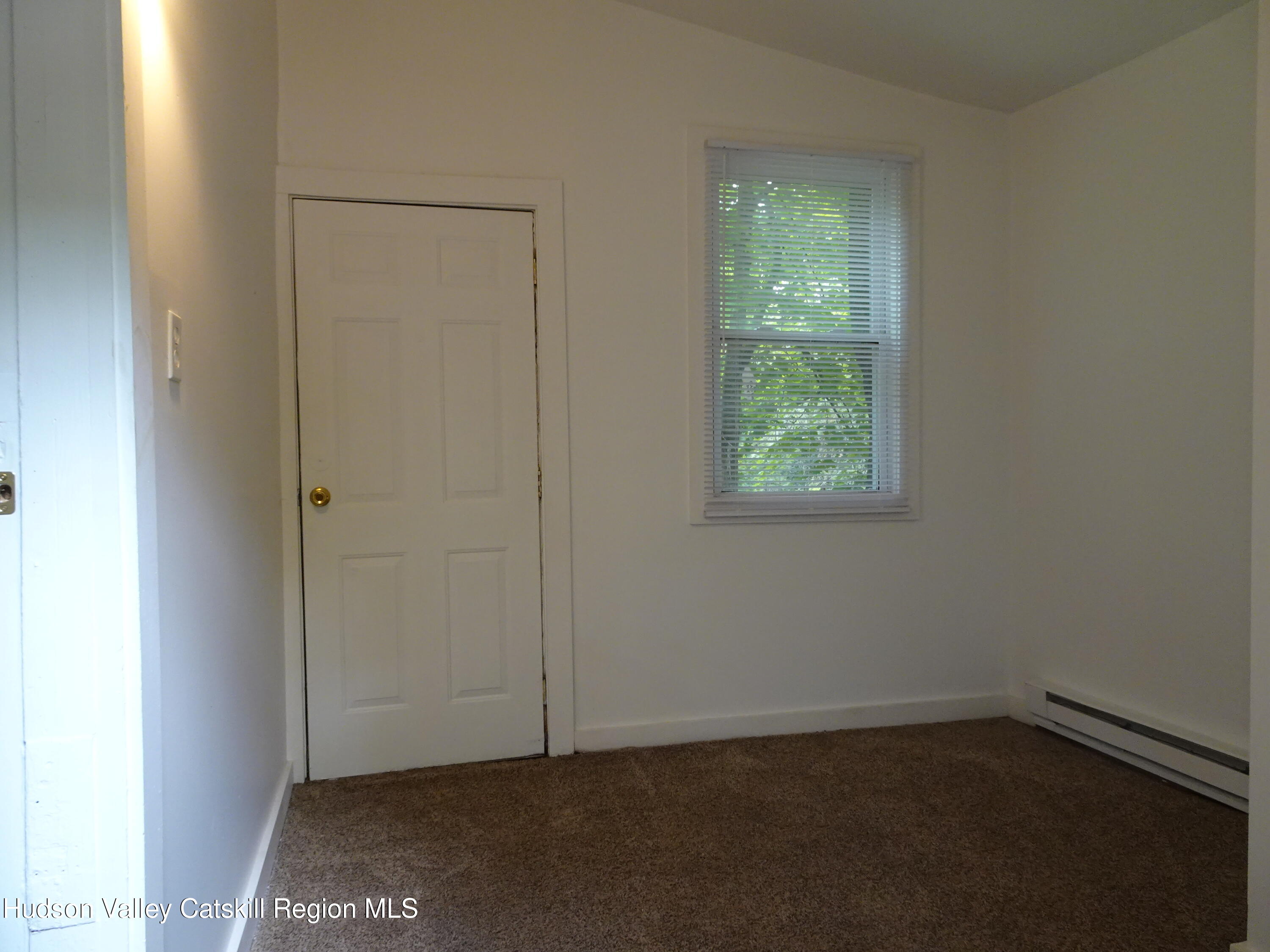 682 Highway 217 Hudson, NY 12534 - Photo 10 of 36 an empty room with window
