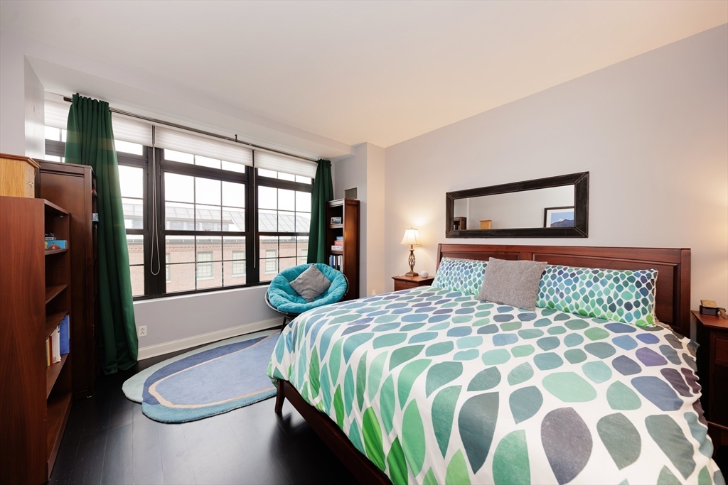 29 Otis Street, Unit 407 Cambridge, MA 02141 - Photo 11 of 31 a bedroom with a bed and a large window