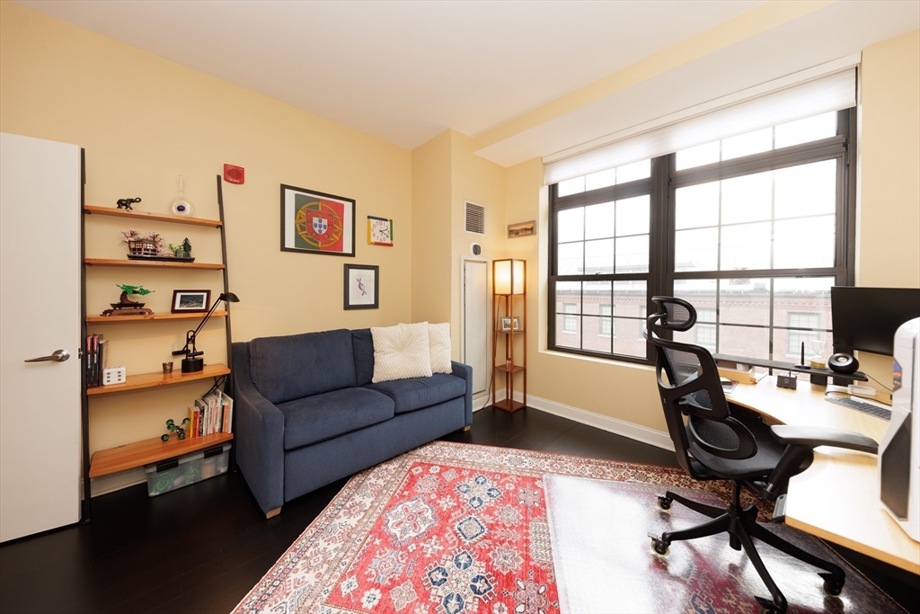 29 Otis Street, Unit 407 Cambridge, MA 02141 - Photo 14 of 31 a living room with furniture and a window