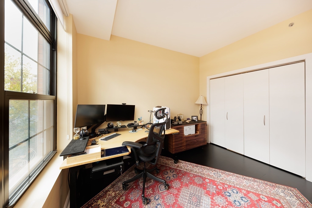 29 Otis Street, Unit 407 Cambridge, MA 02141 - Photo 15 of 31 a workspace with furniture and window