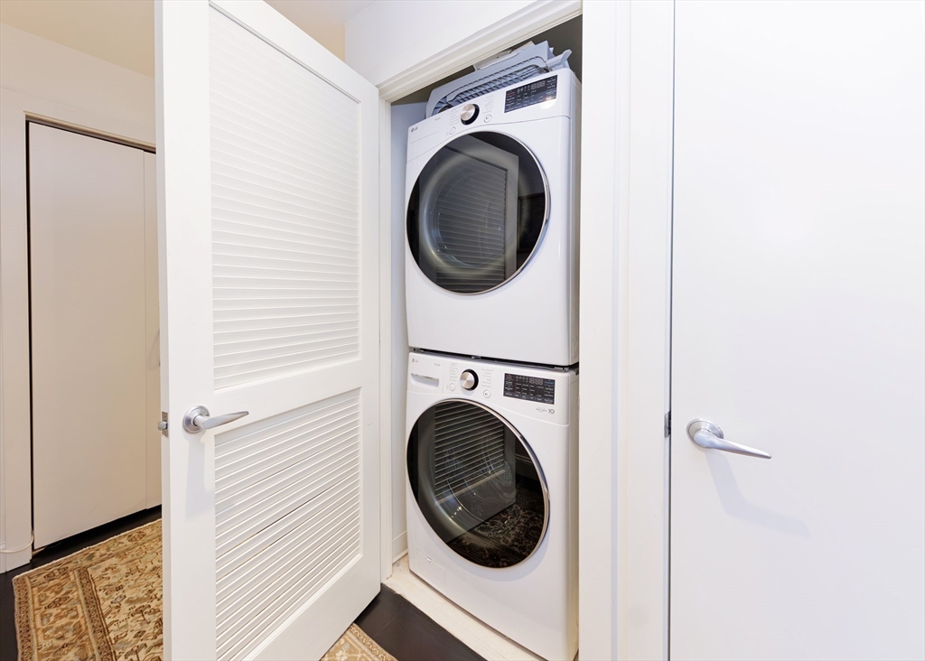 29 Otis Street, Unit 407 Cambridge, MA 02141 - Photo 17 of 31 a close view of a utility room with dryer and washer