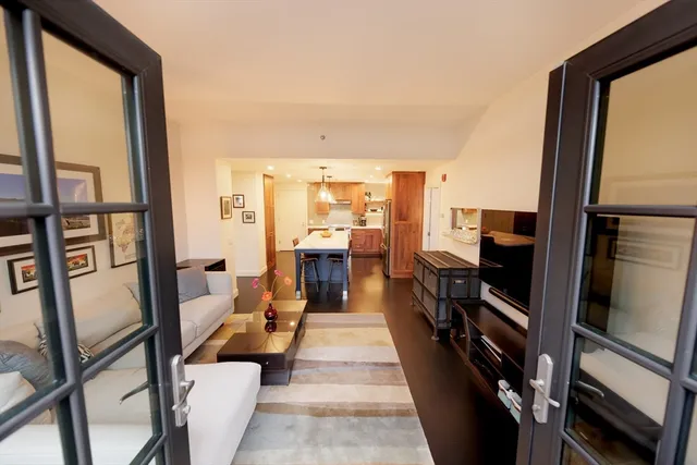 a view of a patio with a table and chairs