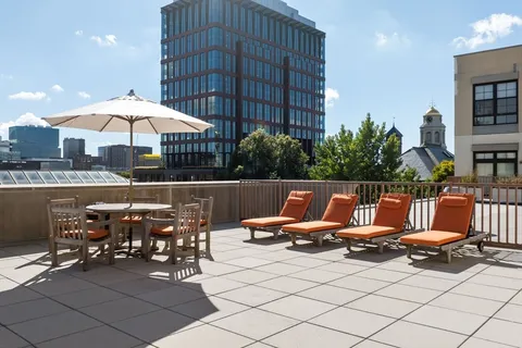 a view of a terrace with furniture and chandelier