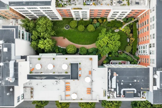 a front view of a house with a yard and outdoor seating