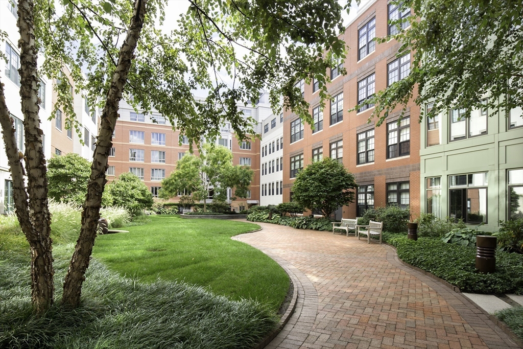 29 Otis Street, Unit 407 Cambridge, MA 02141 - Photo 29 of 31 a view of a building with a yard