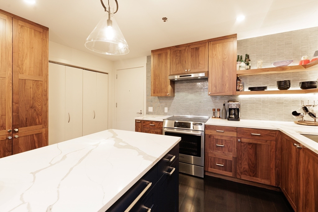 29 Otis Street, Unit 407 Cambridge, MA 02141 - Photo 7 of 31 a kitchen with a sink appliances and cabinets