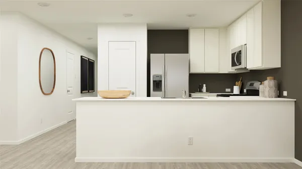 a kitchen with stainless steel appliances granite countertop a sink a stove and a refrigerator with wooden floor