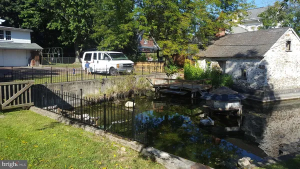 a view of swimming pool with outdoor seating and plants