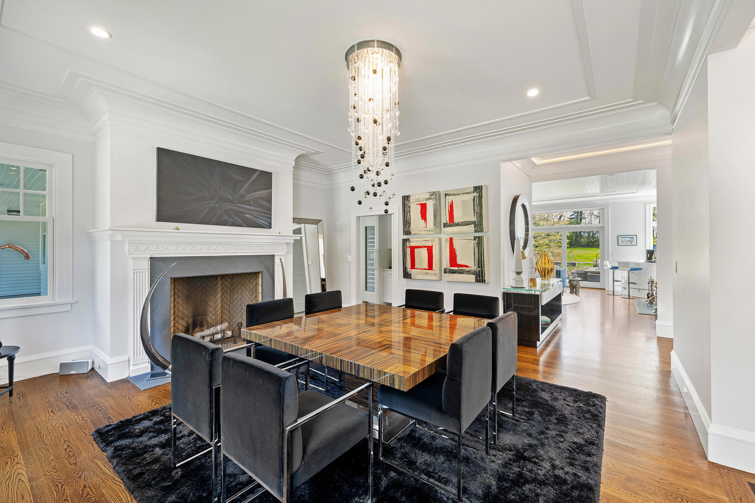 549 Oenoke Ridge New Canaan, CT 06840 - Photo 13 of 54 a living room with furniture a fireplace and kitchen view