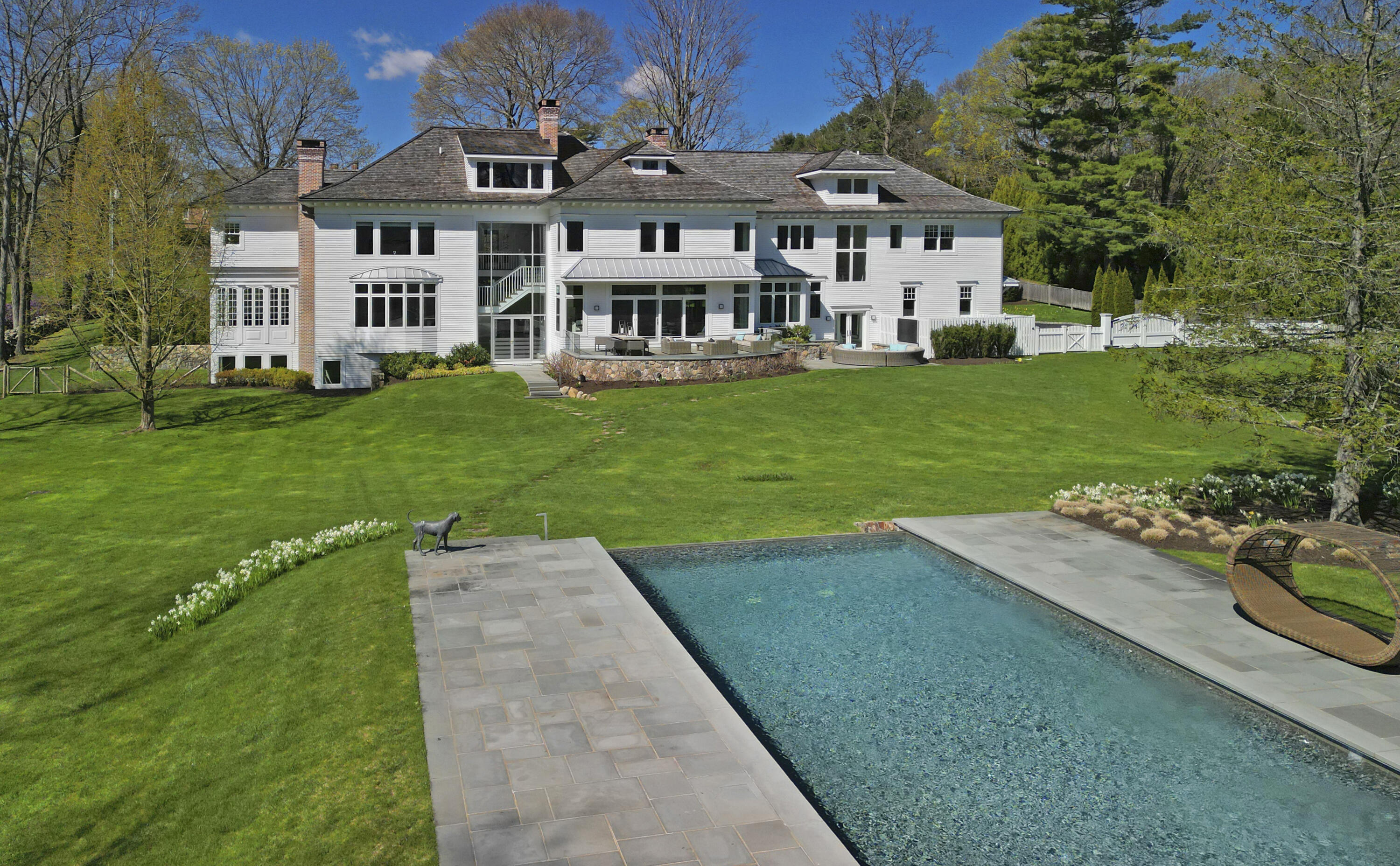549 Oenoke Ridge New Canaan, CT 06840 - Photo 2 of 54 a view of a house with a yard
