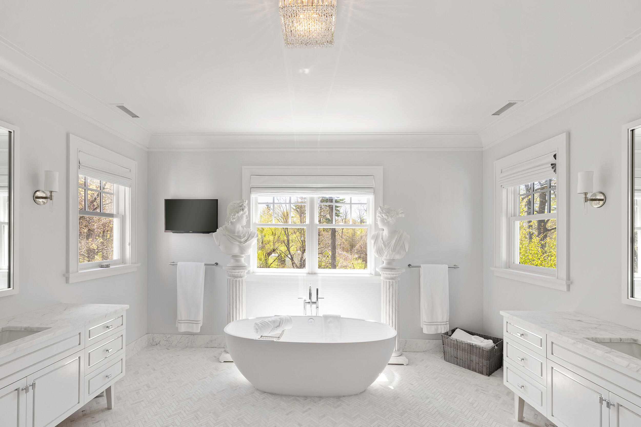 549 Oenoke Ridge New Canaan, CT 06840 - Photo 22 of 54 a bathroom with a bathtub sink and a window