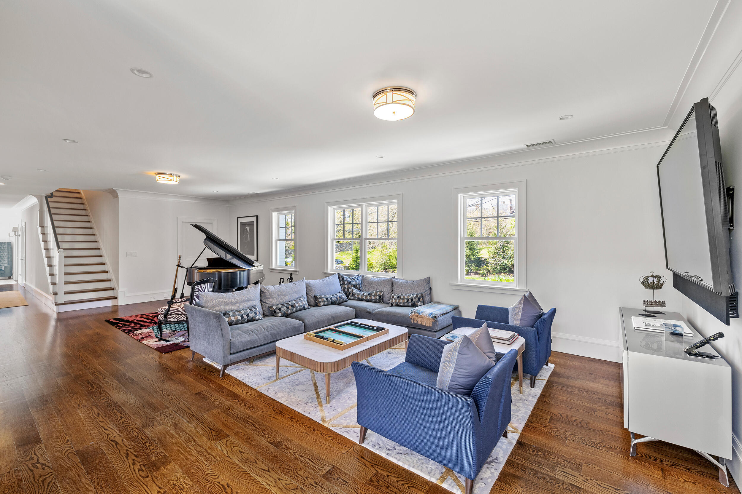 549 Oenoke Ridge New Canaan, CT 06840 - Photo 28 of 54 a living room with fireplace furniture and a flat screen tv