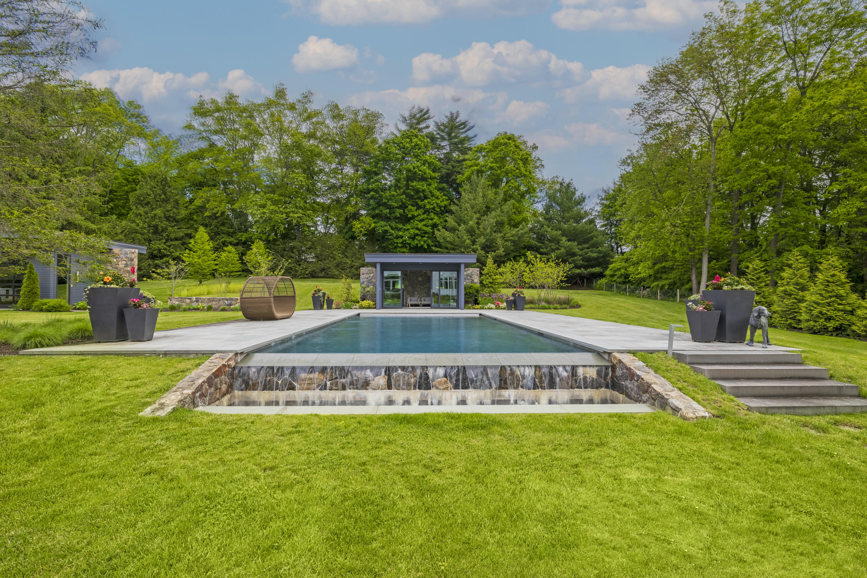 549 Oenoke Ridge New Canaan, CT 06840 - Photo 4 of 54 a view of a house with a yard
