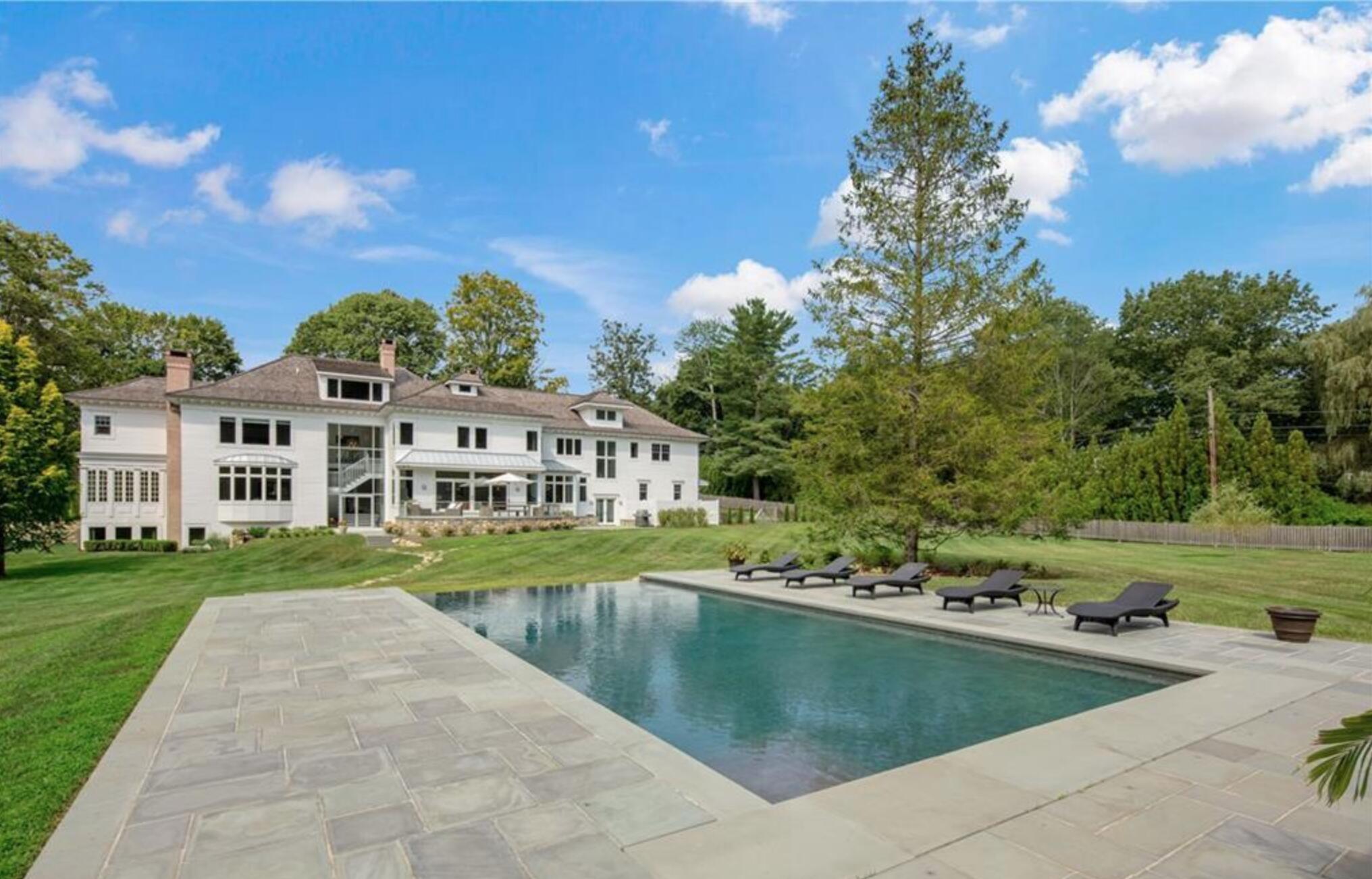 549 Oenoke Ridge New Canaan, CT 06840 - Photo 45 of 54 a view of a house with a yard