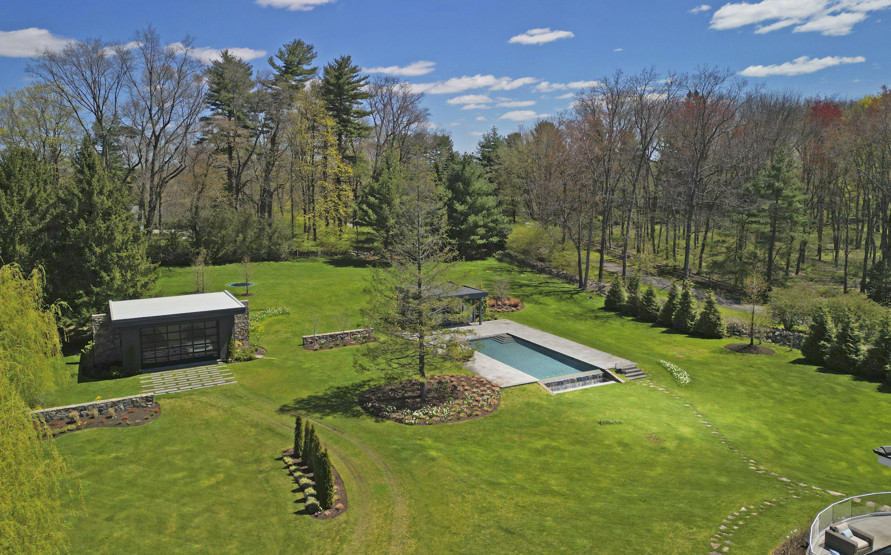 549 Oenoke Ridge New Canaan, CT 06840 - Photo 51 of 54 a view of a house with a yard