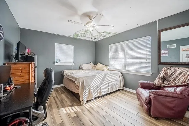 a bedroom with bed and window