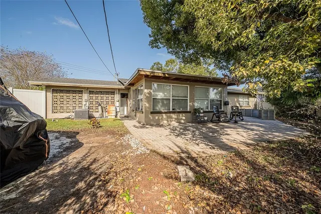 a house view with a backyard space