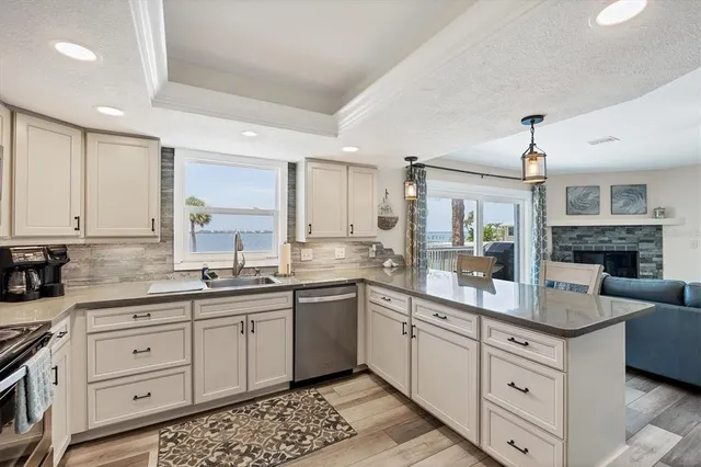 a kitchen with cabinets and chairs