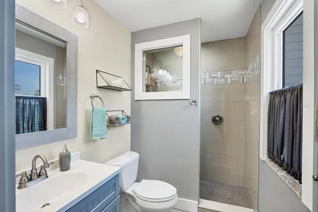 a en suite bathroom with a toilet sink and mirror