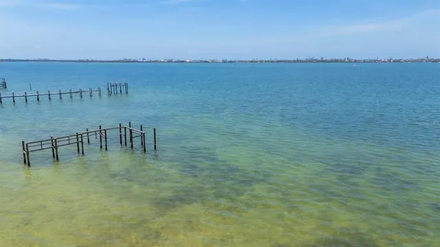 a view of a lake with a yard