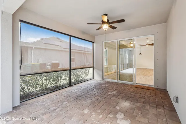 a view of a swimming pool with a patio