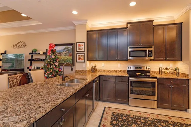 a kitchen with wooden cabinets and a sink