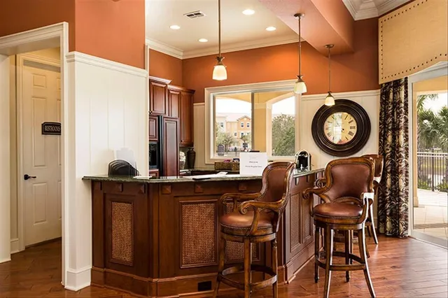 a view of a room with furniture and wooden floor