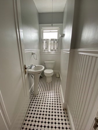 18 Maple Road Longmeadow, MA 01106 - Photo 11 of 26 a bathroom with a sink a toilet a window a mirror and shower