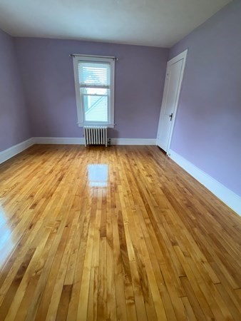18 Maple Road Longmeadow, MA 01106 - Photo 15 of 26 a view of empty room with wooden floor and fan