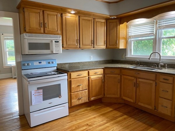 18 Maple Road Longmeadow, MA 01106 - Photo 5 of 26 a kitchen with granite countertop cabinets stainless steel appliances and a sink