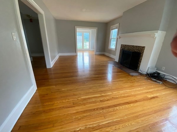 18 Maple Road Longmeadow, MA 01106 - Photo 8 of 26 a view of an empty room with wooden floor and a window