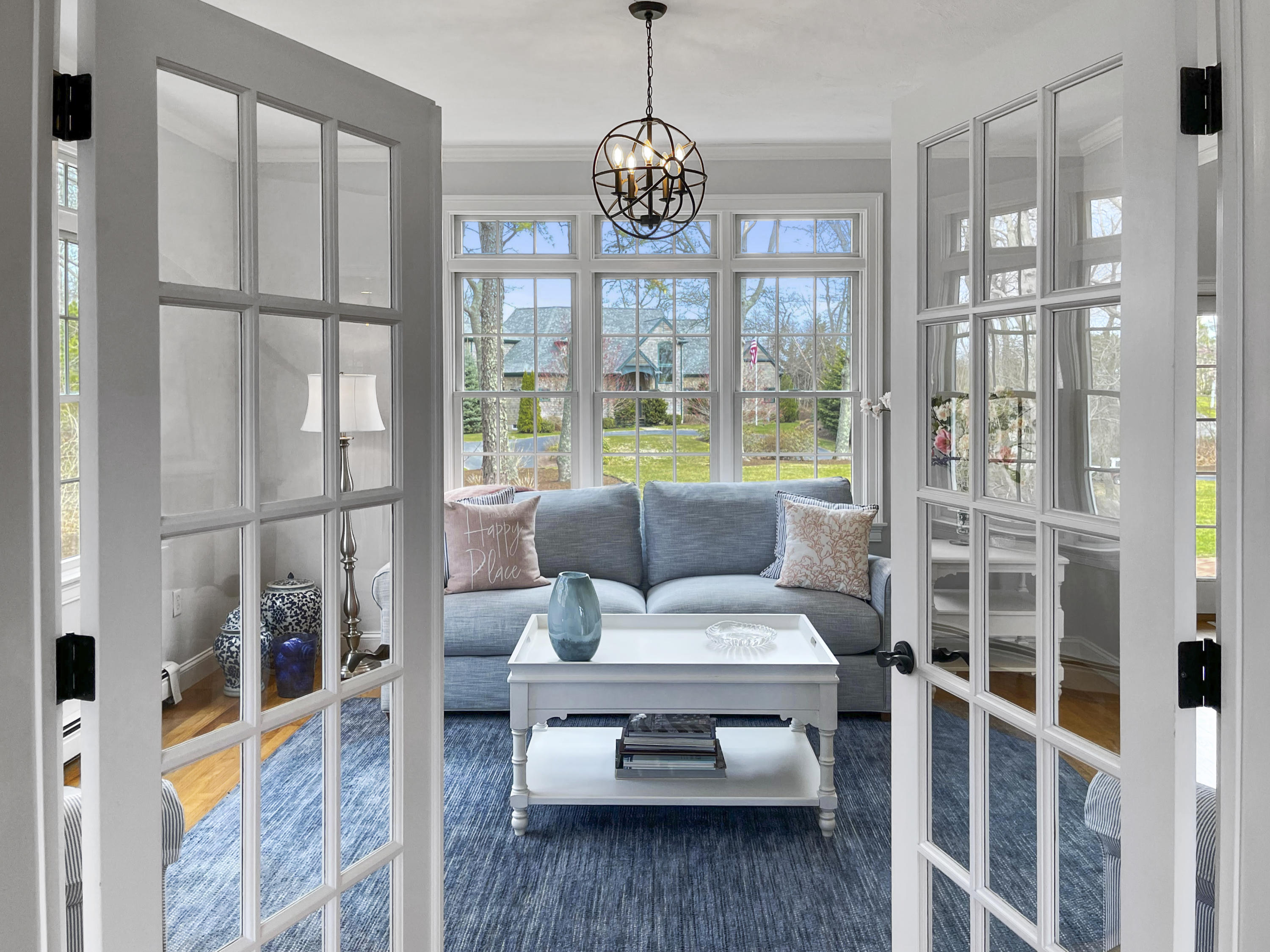 215 Cairn Ridge Road East Falmouth, MA 02536 - Photo 12 of 60 a living room with furniture and a floor to ceiling window