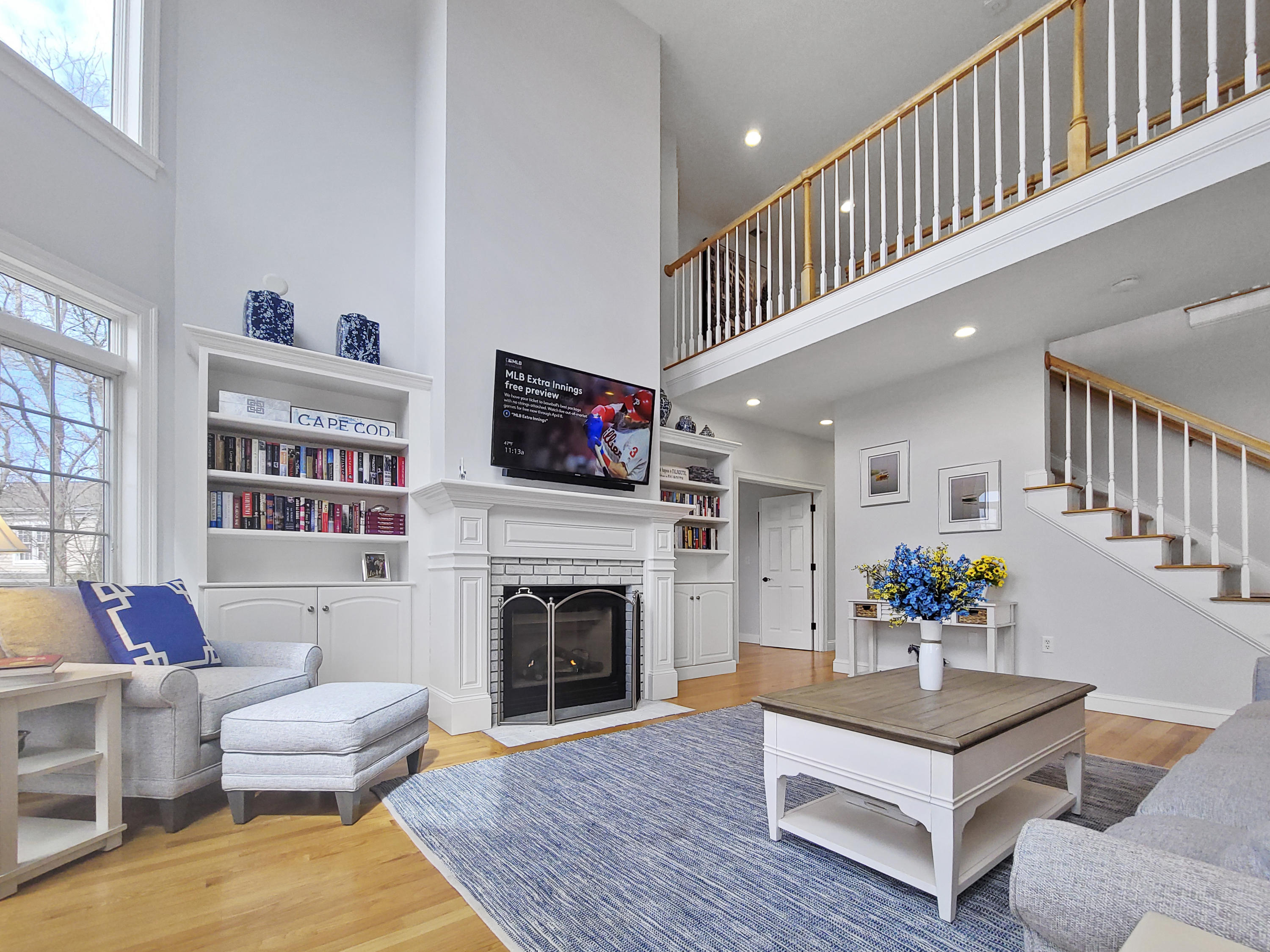 215 Cairn Ridge Road East Falmouth, MA 02536 - Photo 15 of 60 a living room with furniture and a fireplace
