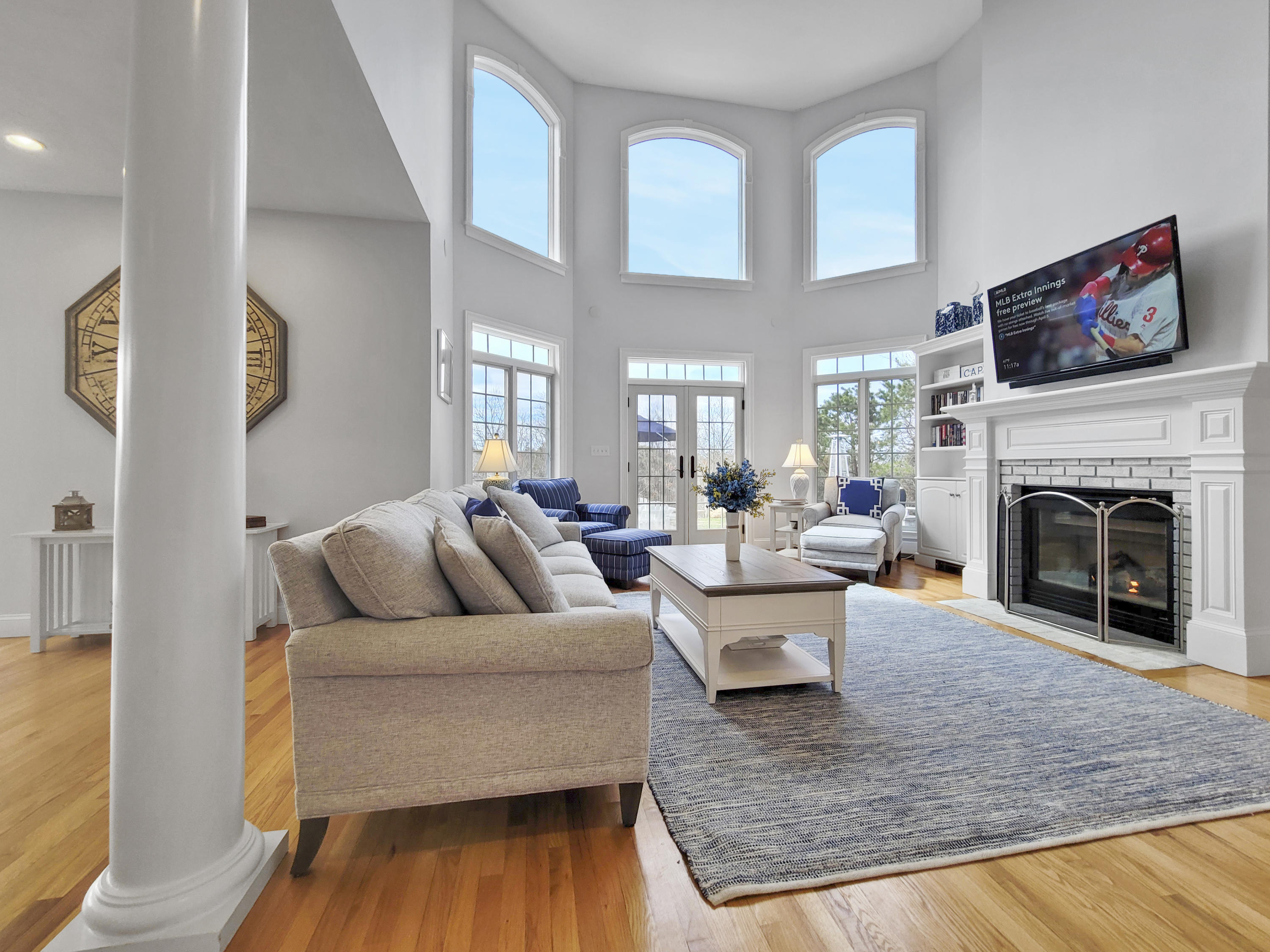 215 Cairn Ridge Road East Falmouth, MA 02536 - Photo 18 of 60 a living room with furniture and a fireplace