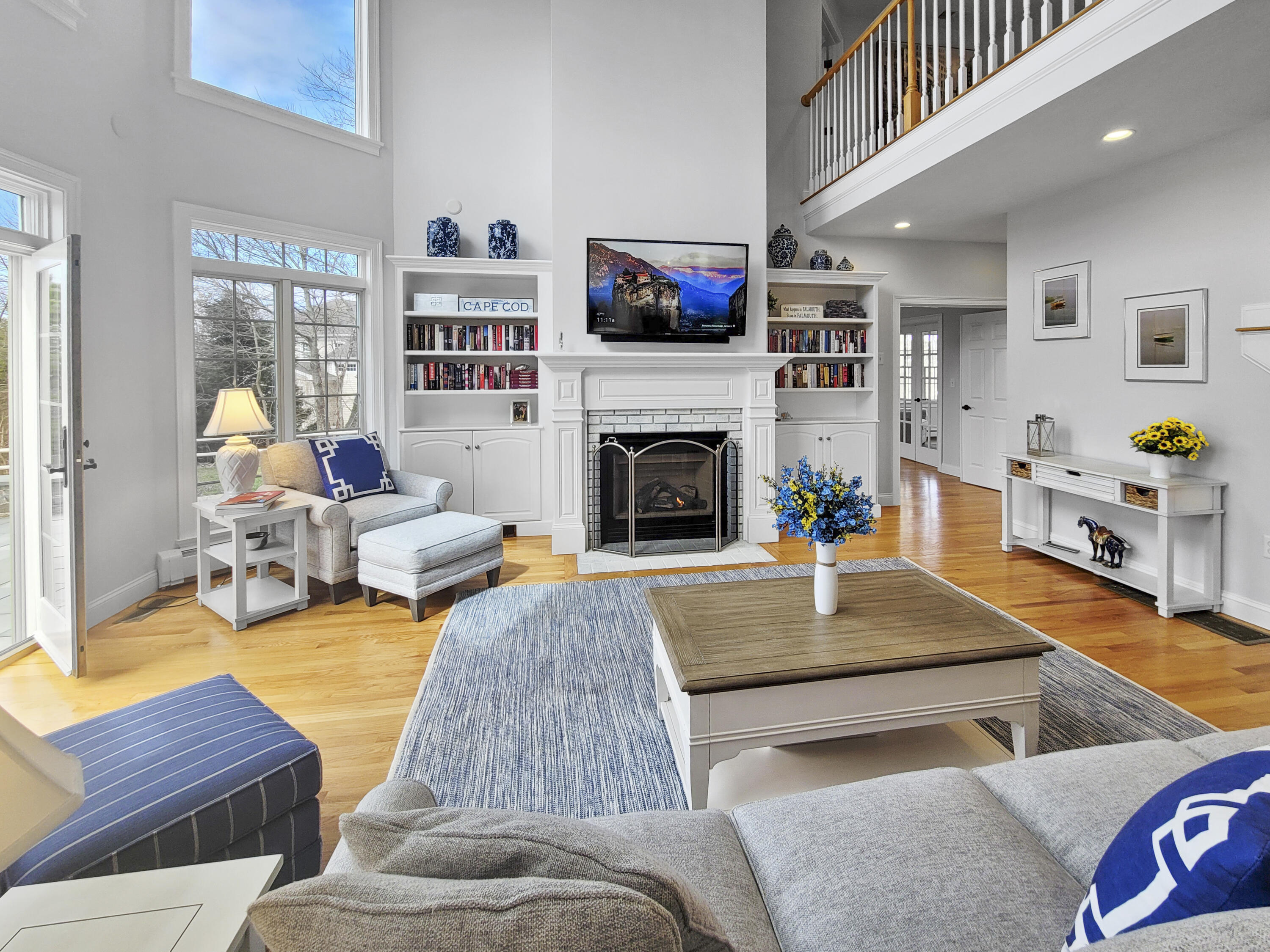 215 Cairn Ridge Road East Falmouth, MA 02536 - Photo 19 of 60 a living room with furniture and a fireplace