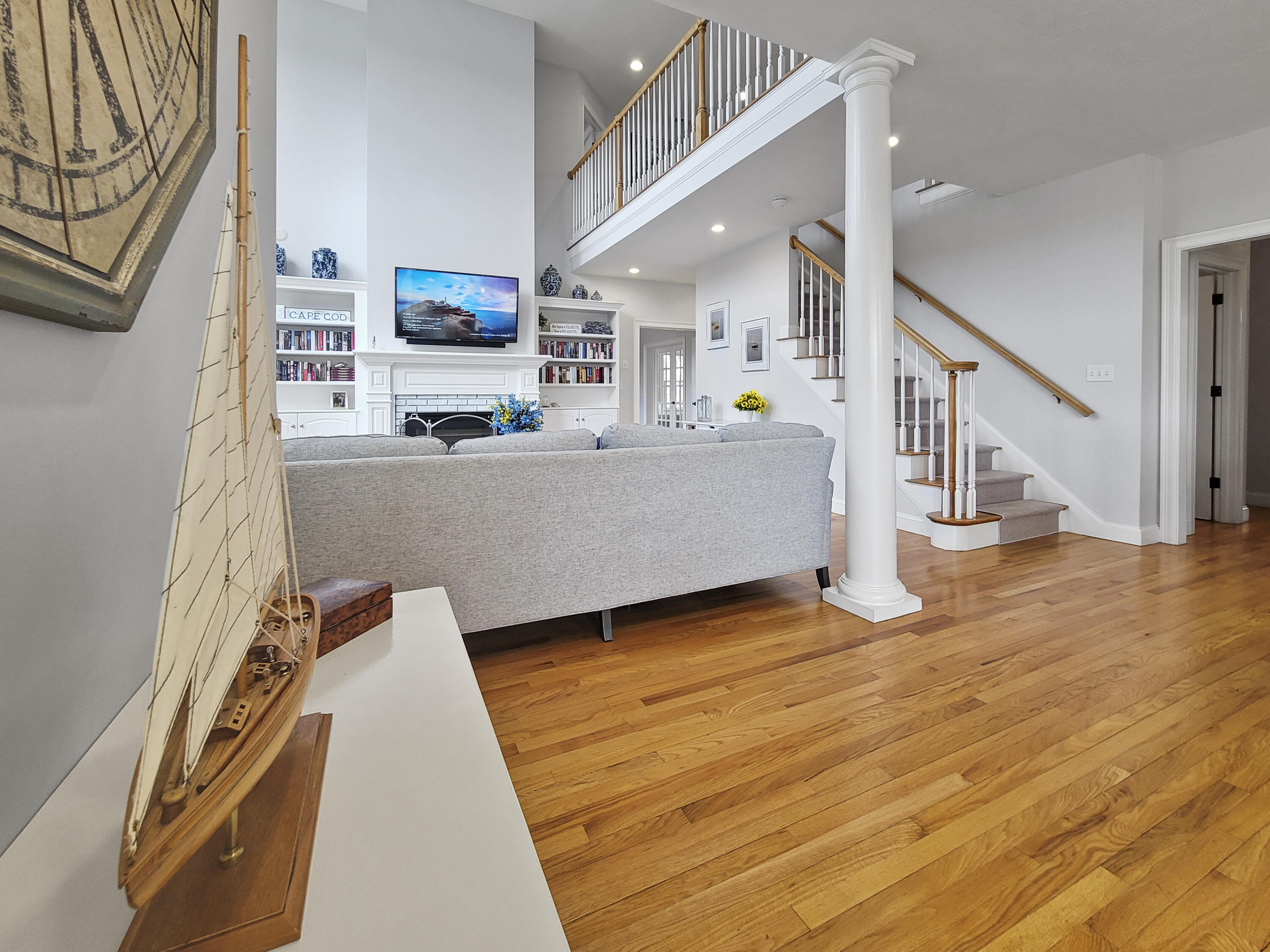 215 Cairn Ridge Road East Falmouth, MA 02536 - Photo 20 of 60 a living room with furniture and a flat screen tv