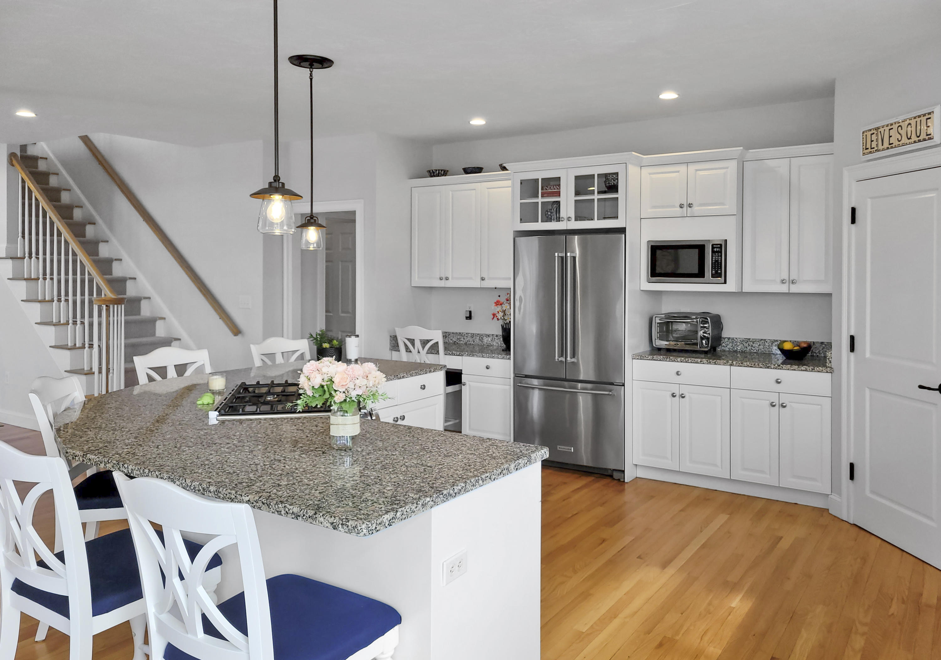 215 Cairn Ridge Road East Falmouth, MA 02536 - Photo 24 of 60 a kitchen with stainless steel appliances granite countertop a sink a stove a refrigerator and cabinets