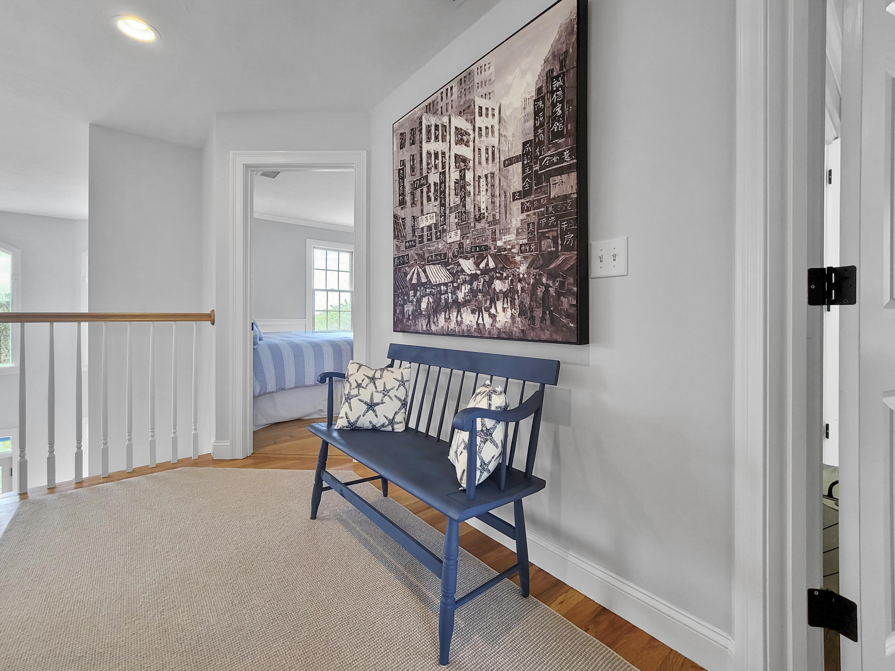 215 Cairn Ridge Road East Falmouth, MA 02536 - Photo 28 of 60 a view of a hallway with wooden floor and a potted plant